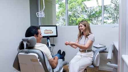 A photo of doctor Thanos talking with patient