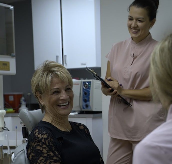 A photo of happily smiling client with our team member