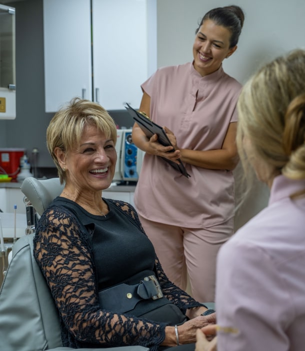 A photo of our team and happily smiling client