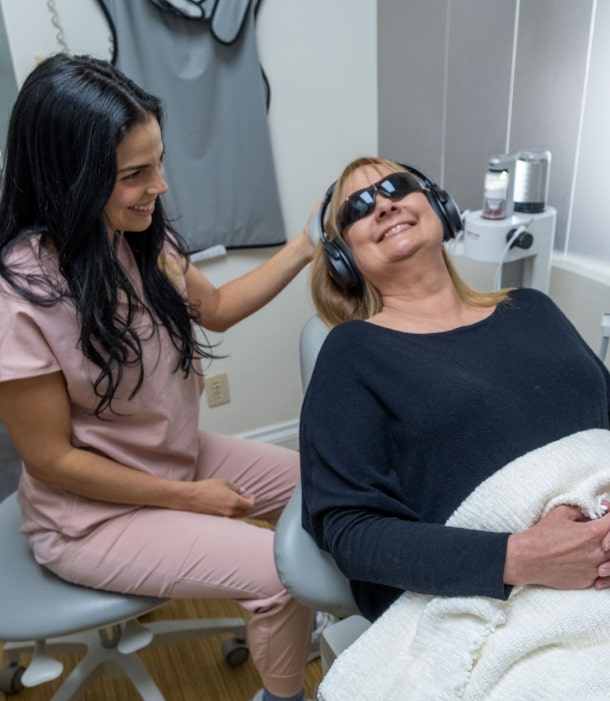 A photo of our team member and happy smiling patient