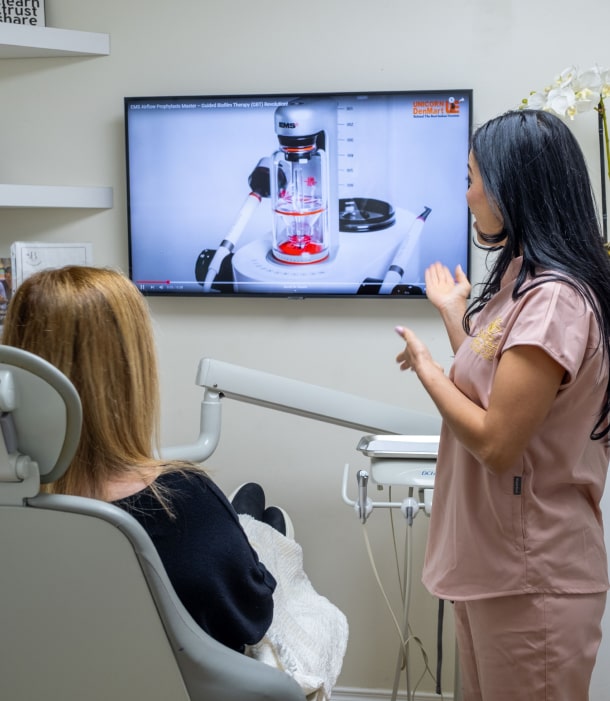 A photo of our team member explain to patient procedure