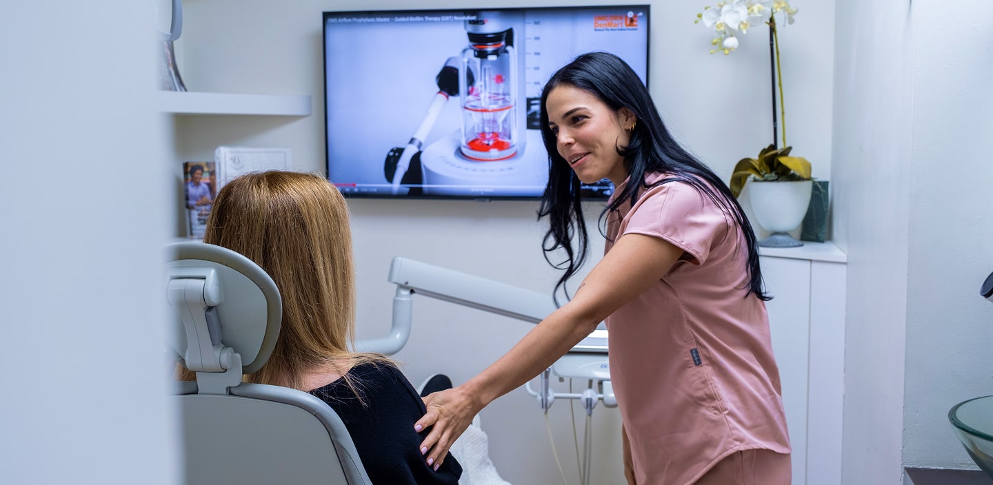 A phot of our team member talking with patient before procedure